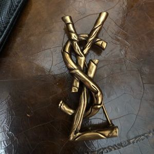 YSL brooch. Dark gold